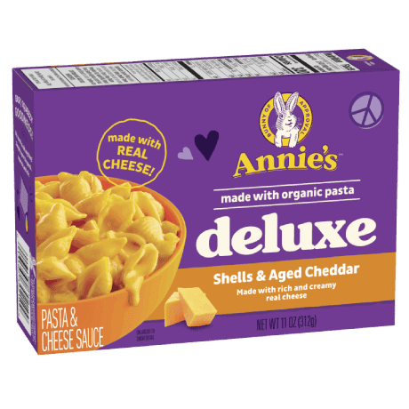 Annie's Deluxe Rich And Creamy Shells And Aged Cheddar Pasta, real cheese sauce, made with organic pasta, 306g, front of box.