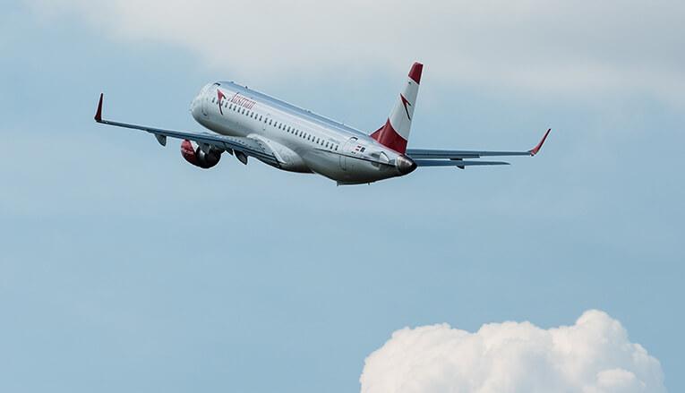 An image of a airplane with blue sky behind it.